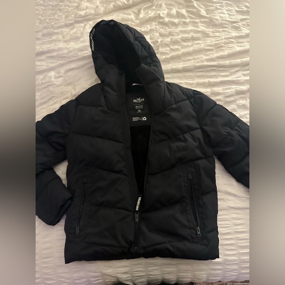 Black Hollister Winter Coat. Has a soft lined hood.